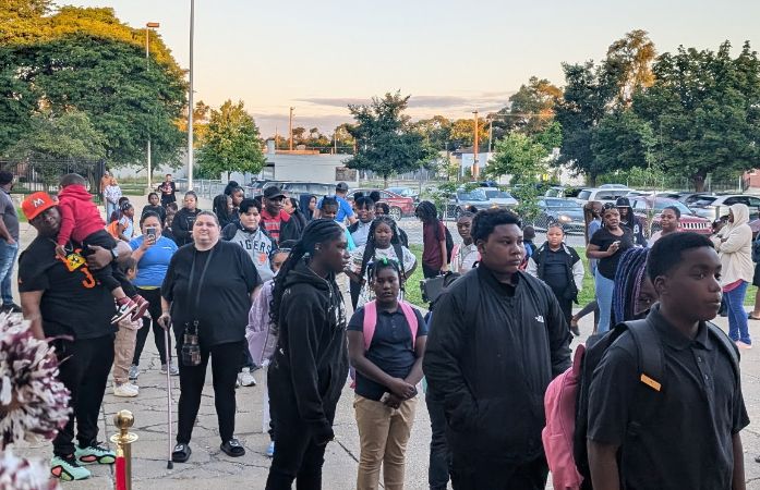  Students and parents in the clap in line